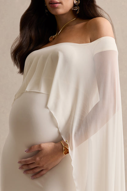 Bluma | Vestido Largo Premamá Crema Con Escote Bardot, Falda Semitransparente Y Detalle Capa