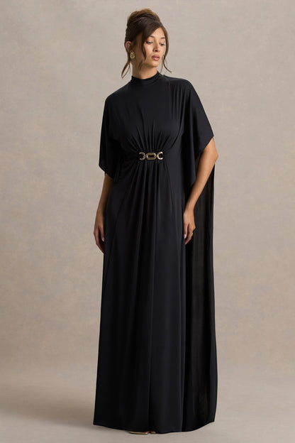 Olessia | Vestido negro con mangas tipo capa y cinturón con detalles dorados