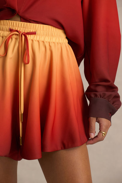 Gold Coast | Pantalones cortos satinados con degradado naranja