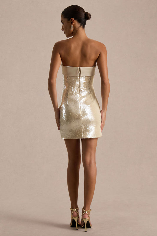 Casandra | Vestido corto de lentejuelas champagne con escote bandeau y detalle de satén