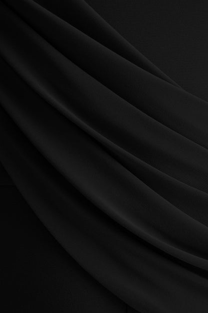 Labina | Mono negro con escote pronunciado y mangas capa