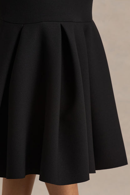 Liberty | Vestido midi negro con mangas largas y bajo con volante