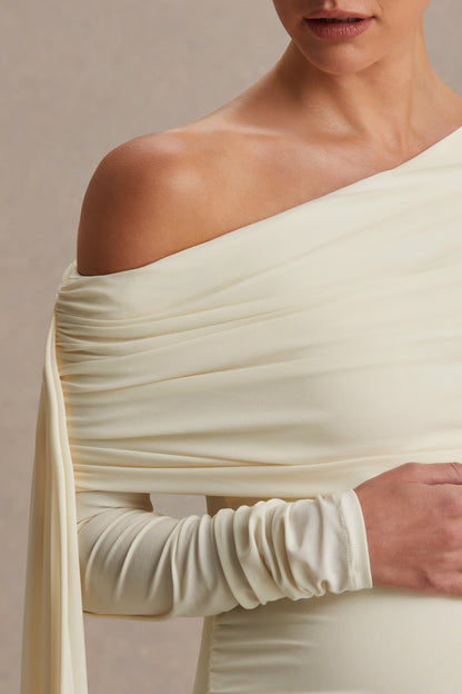 Cyra | Vestido largo crema con escote asimétrico y fajín