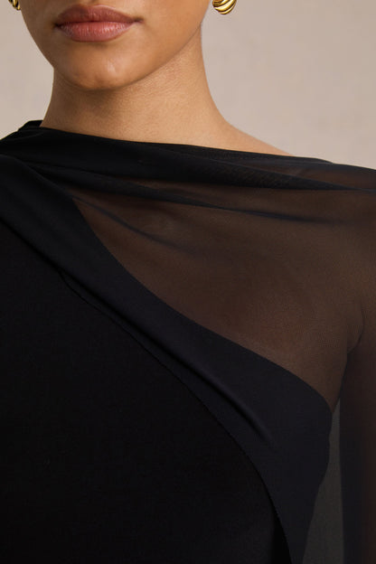 Mirelle | Vestido Largo negro con escote asimétrico y manga-capa transparente