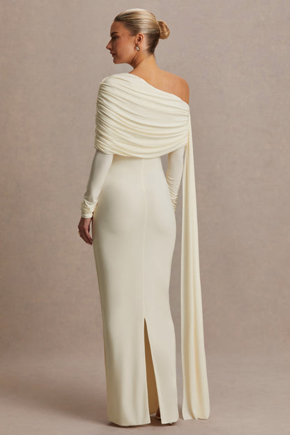 Cyra | Vestido largo crema con escote asimétrico y fajín